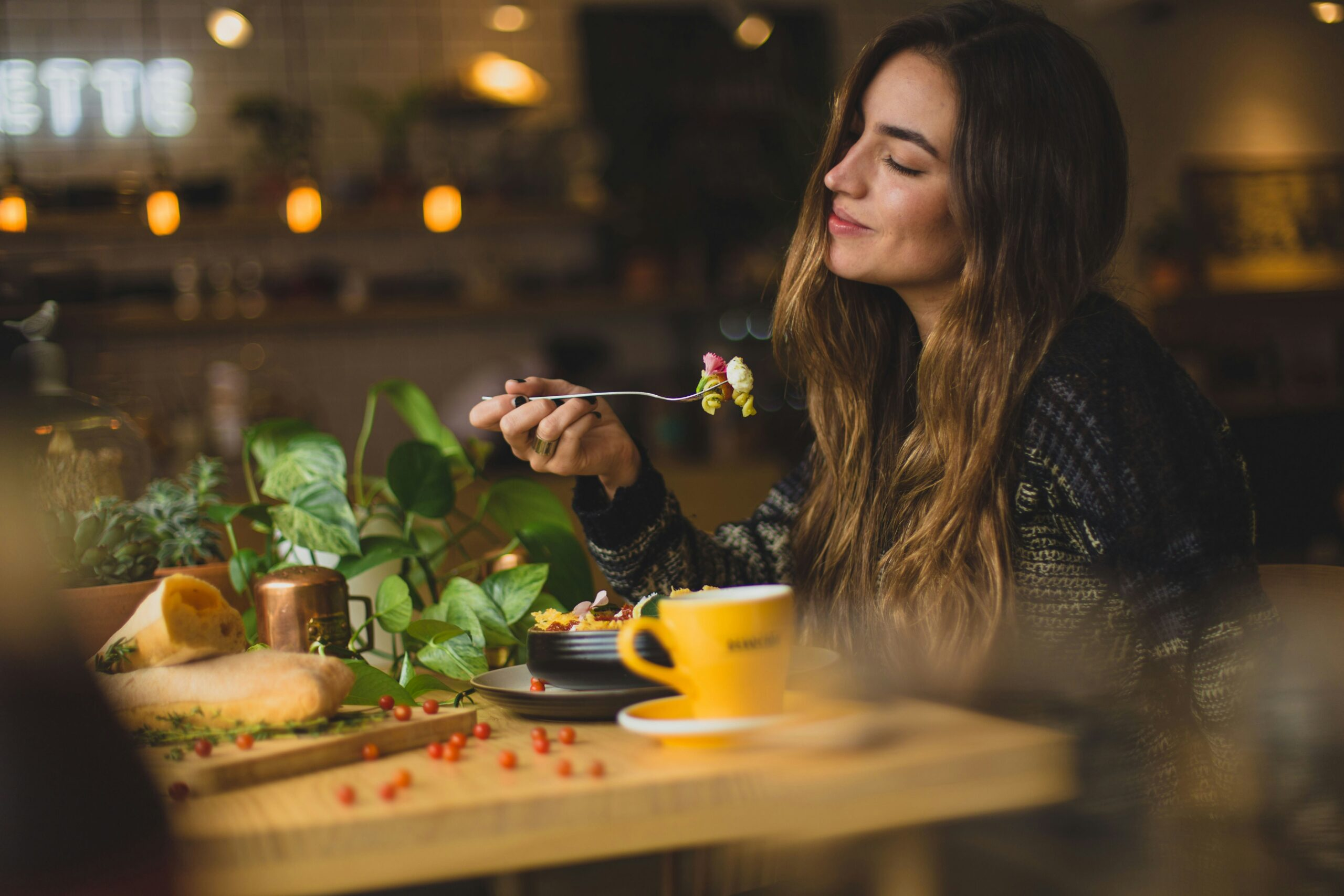 A solo traveler enjoying a meal at a cozy café