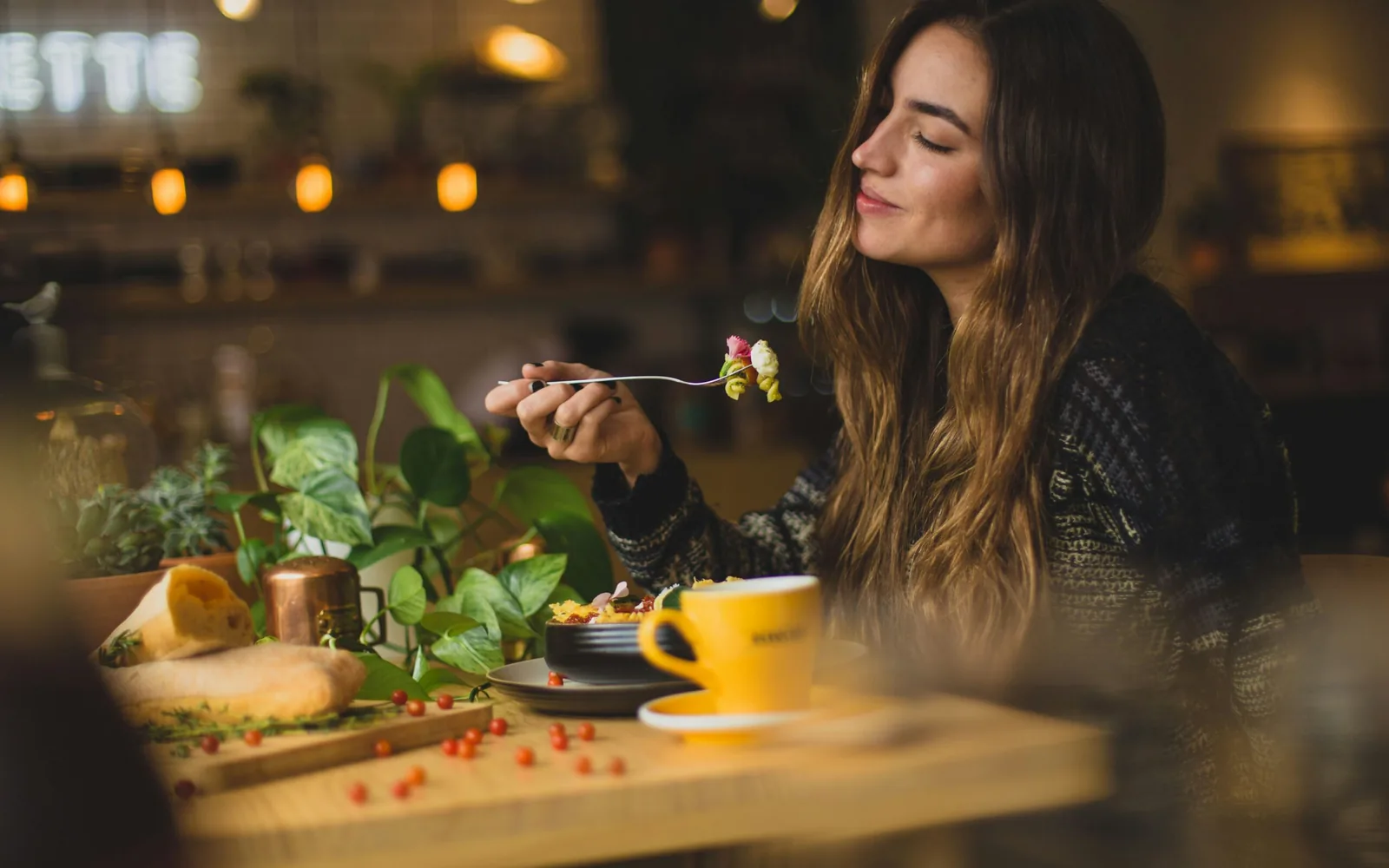 A solo traveler enjoying a meal at a cozy café